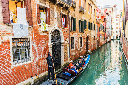 Gondolas on narrow canal in Venice, Italy