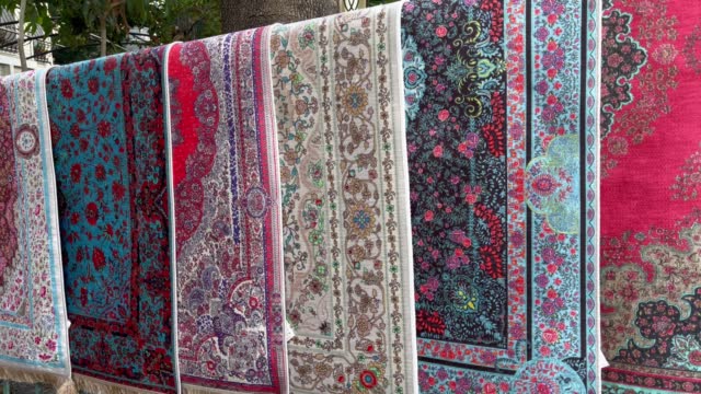 Colorful carpets hanging on street market in Istanbul city
