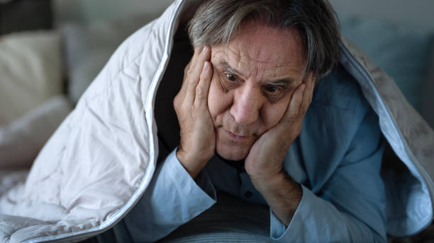 istock Insomniac old man in bed 1441857493
