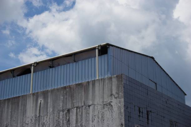 istock Rooftop of warehouse with skyscrape 1441859587