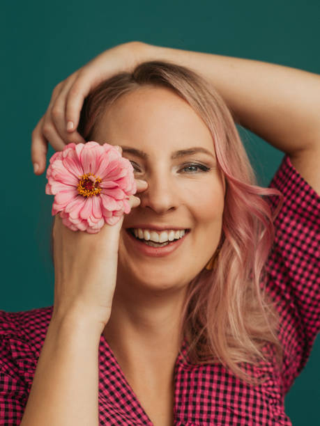 istock Beautiful woman with flowers studio shot 1441859802