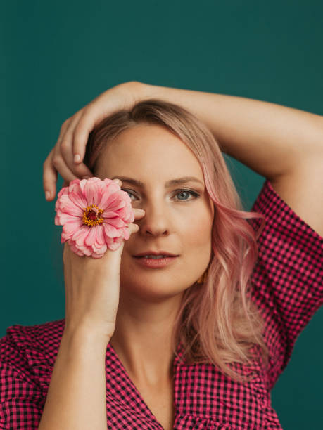 istock Beautiful woman with flowers studio shot 1441860906