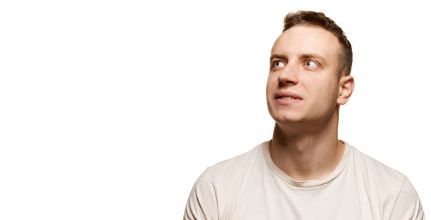istock Portrait of young man with smooth shaved face isolated over white studio background. Concept of men's health, body and skin care 1441862554