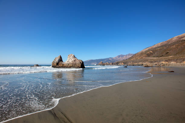 Rising tide at Pacific Valley beach on the Big Sur central California coastline United States stock photo