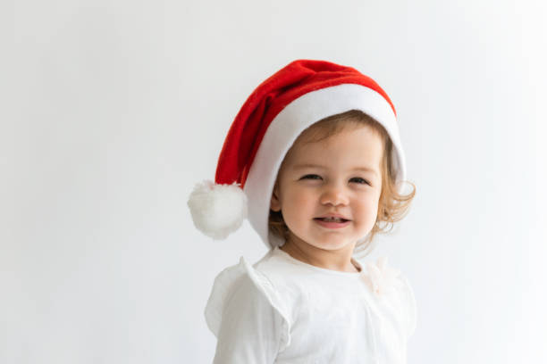 istock Little Girl with Santa Hat. 1441865930