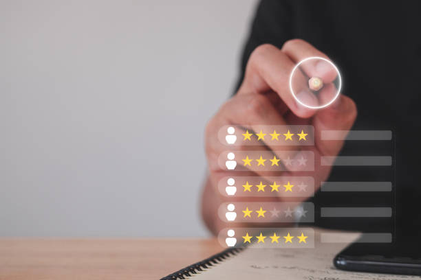 istock Human Resource management. Evaluation and satisfaction concept. Finding the best person for a work. Close up shot on tip of pen with a book and smartphone. Photo with virtual screen. 1441866780