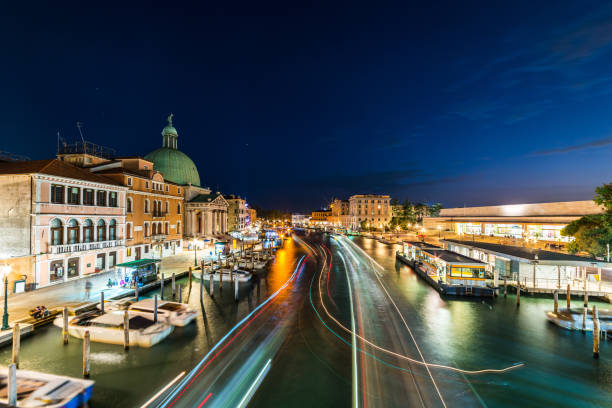 Venice, Italy. Venice city panoramic sunset view. Beautiful sunset view at Grand Canal with many gondolas. View of the Grand Canal from the Bridge of the Barefoot (Ponte degli Scalzi).