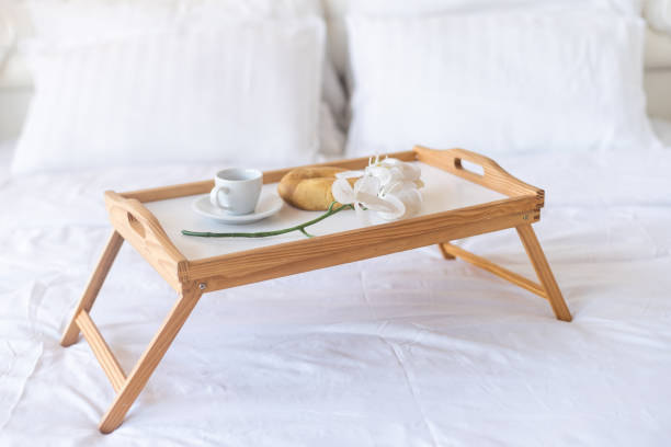 breakfast, a tray with breakfast on the bed