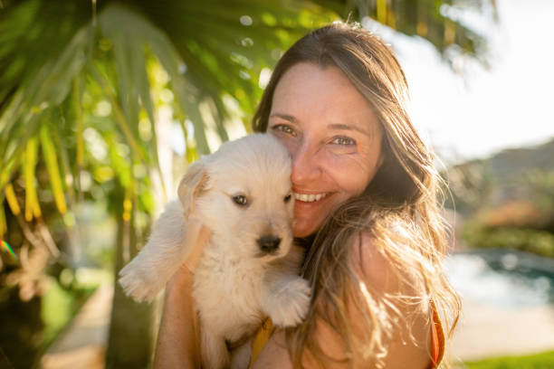 istock People having fun with the cute dog 1441872255