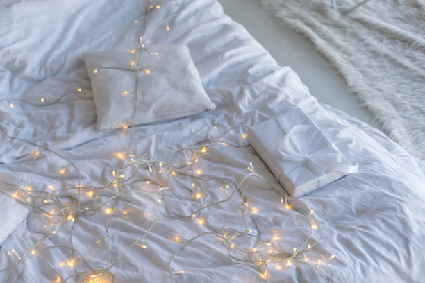 istock a bed on a with New Year's a garland for Christmas 1441872276
