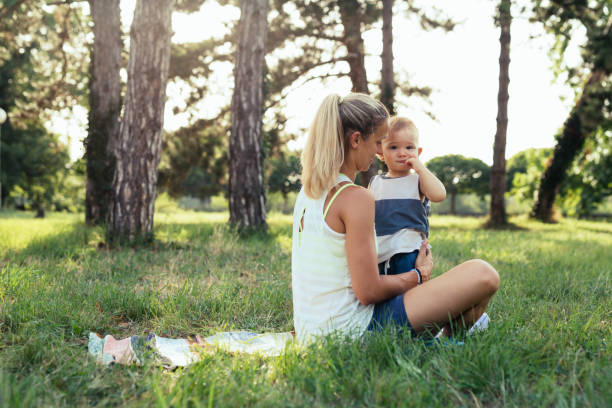 istock mother and her son exercises outdoor 1441876713