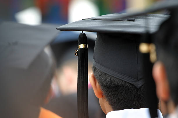 Center focus shot of tassel at graduation ceremony stock photo