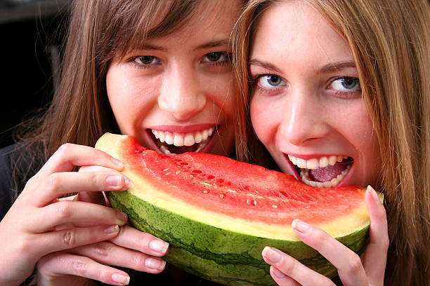 istock Young girls enjoying a fruit 144187940