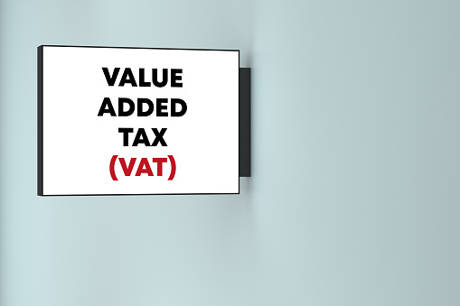 Value Added Tax lettering on the lightbox on the wall. Business Terms Concept.