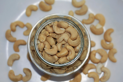 Cashew in glass bowl table top view with selective focus,