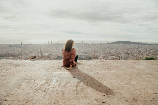 istock Woman looking at Barcelona 1441883145