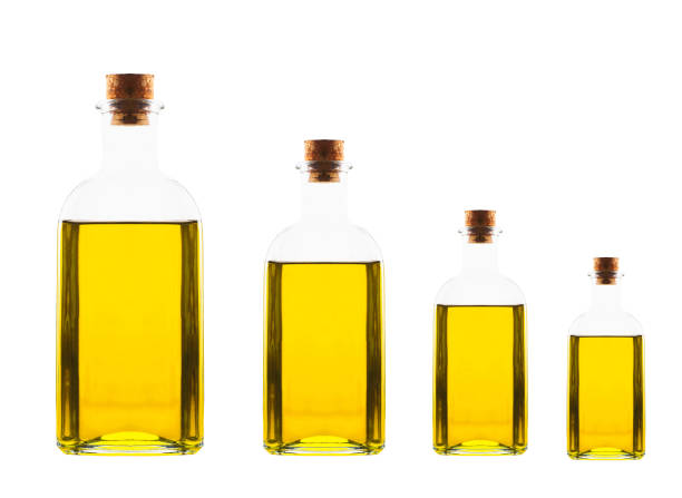 different size bottles with olive oil different size bottles with olive oil isolated on white  background olive oil pouring antioxidant liquid stock pictures, royalty-free photos & images