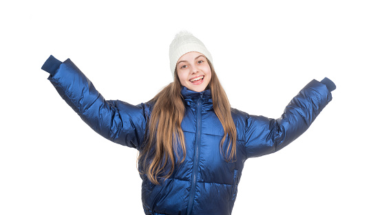 happy teen girl in winter clothes. warm clothes for cold weather. childhood happiness. small kid wear padded coat isolated on white. child in puffer jacket and hat. autumn fashion style.