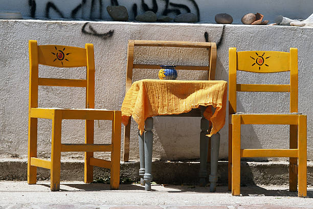 two greek chairs with table stock photo