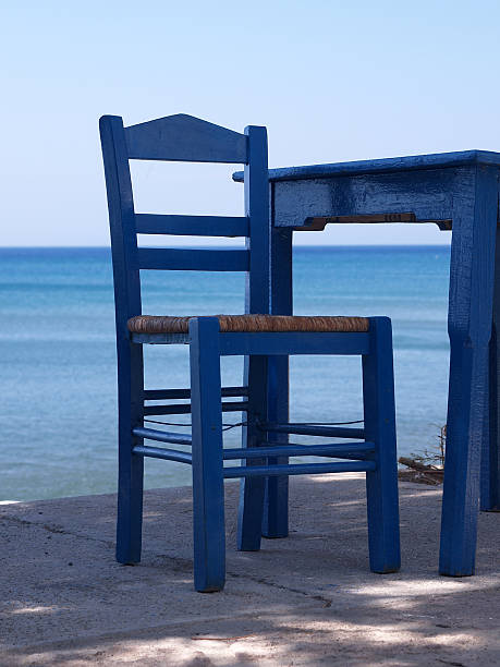 greek chair at the sea stock photo