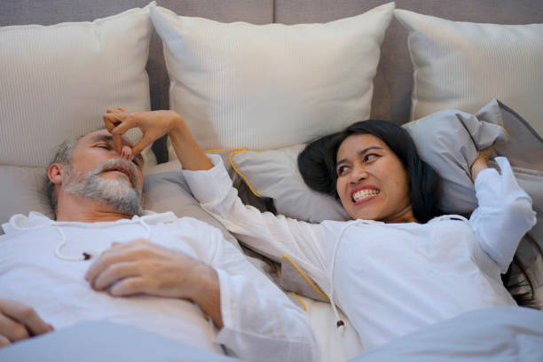 Couple are sleeping in the bedroom. stock photo
