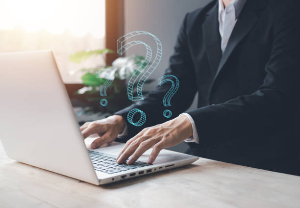 istock Question mark symbol with businessman hand typing notebook (Laptop). Thinking Concept. 1441885374