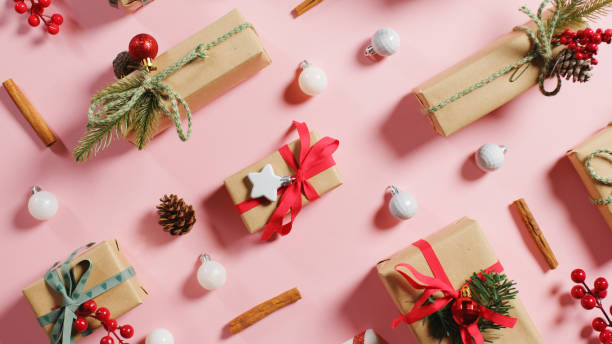istock Christmas presents on pink background 1441886350
