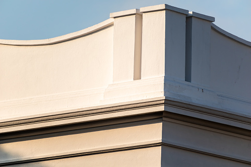 Detail of the elegant vintage grey rooftop of an old French colonial era building in the heritage town of Pondicherry.