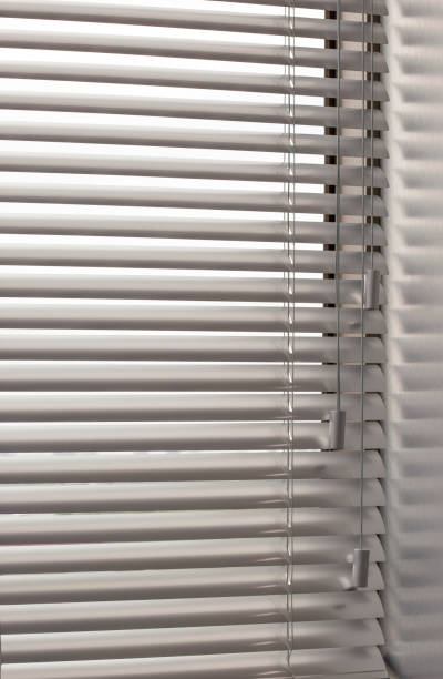 istock Aluminum blinds closeup on the window 1441888868