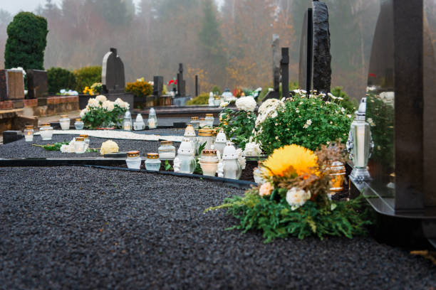 Decorated graves on Cemetery just before All Saints Day.Foggy day.