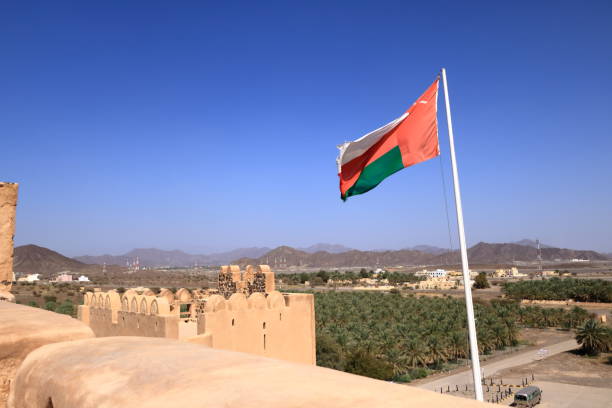 a Large Oman flag waving in the wind