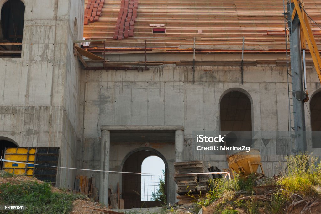 Construction site, house under construction, no windows, roofing in progress, post-earthquake repair Architecture Stock Photo