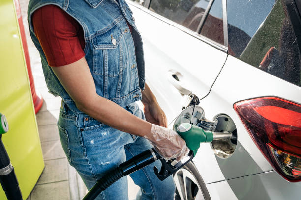 istock Woman Fueling the Car 1441894714