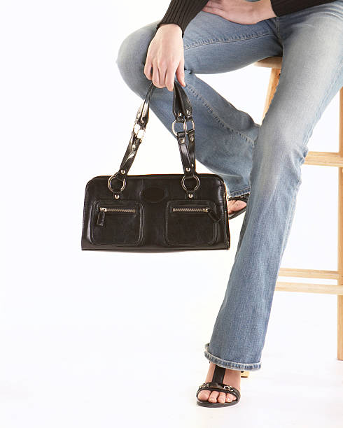 istock Woman holding handbag 144189525