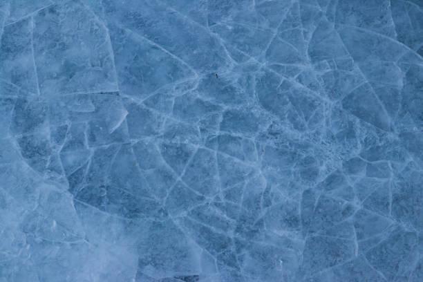 istock Texture of the cracked ice. Winter background 1441895889