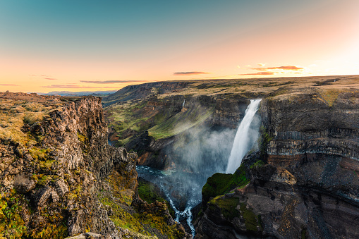 Majestic powerful Haifoss waterfall flowing on volcanic canyon among the Icelandic Highlands on summer in Iceland