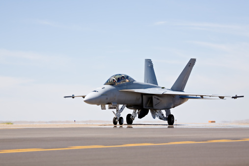 F-18 Hornet military fighter aircraft taxis for takeoff