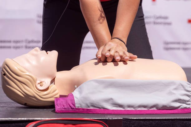 istock First aid training or Cardiopulmonary resuscitation course on CPR dummy 1441900865