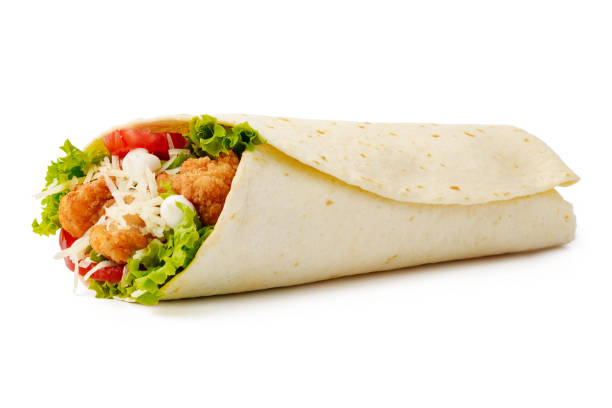 Tortilla wrap with fried chicken meat and vegetables isolated on white background