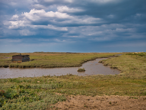 The North Norfolk coastal wetlands, in the east of the UK. Taken on a calm, sunny day in summer with a blue sky.