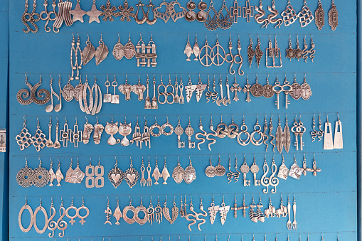 Rows of metal earrings hanging at a stall in Sultanahmet - Istanbul, Turkey