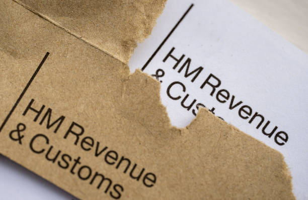 HMRC tax letter HMRC opening a tax letter. sable stock pictures, royalty-free photos & images