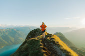 Man hiking  on the background of Interlaken in Swiss Alps