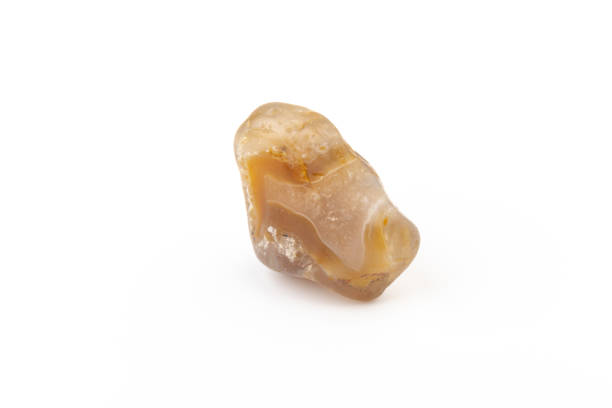 istock Multicolored gemstone, tumbled mineral. Bostwan agate of various sizes on a white background. 1441906577