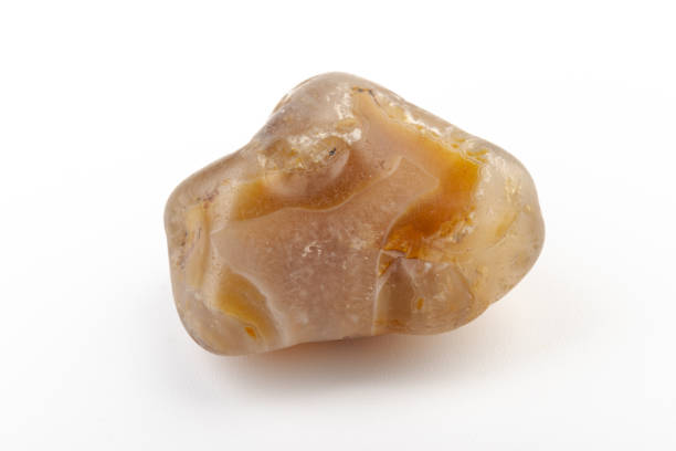 istock Multicolored gemstone, tumbled mineral. Bostwan agate of various sizes on a white background. 1441906587