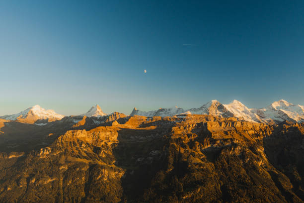 Scenic view of snow-covered Swiss Alps  in autumn at twilight