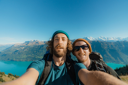 Selfie of two mens hiking in mountains