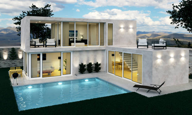 istock 3D rendering of a beautiful modern house with swimming pool and night light 1441909488