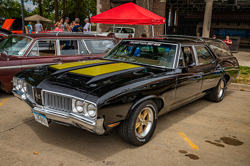 Des Moines, IA - July 02, 2022: High perspective front corner view of a 1970 Oldsmobile 442 Vista Cruiser Station Wagon at a local car show.