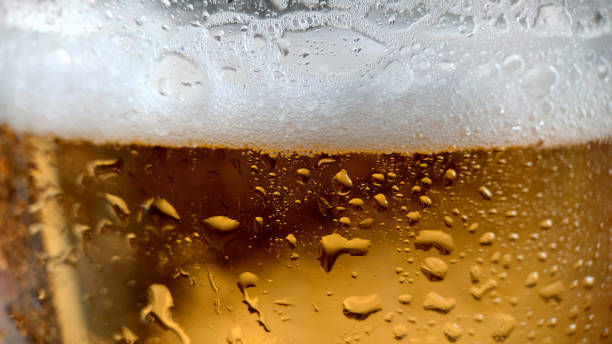 istock White foam and unfocused water drops on the glass 1441911310